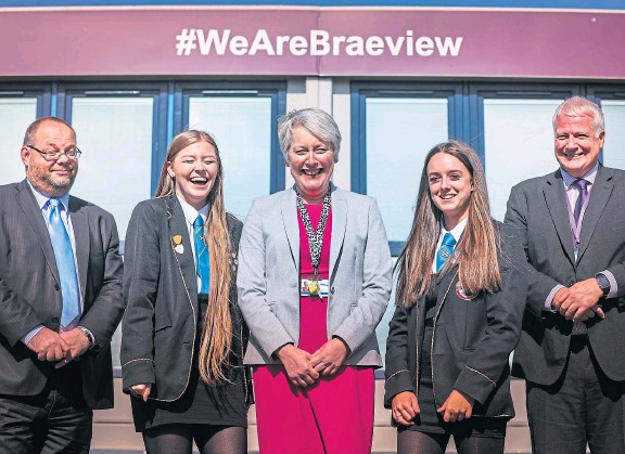 L. Elder with pupils and officials